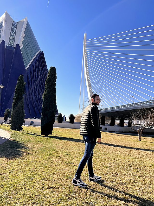 Nico walking across the grass at the City of Arts and Sciences in Valencia, on a sunny day