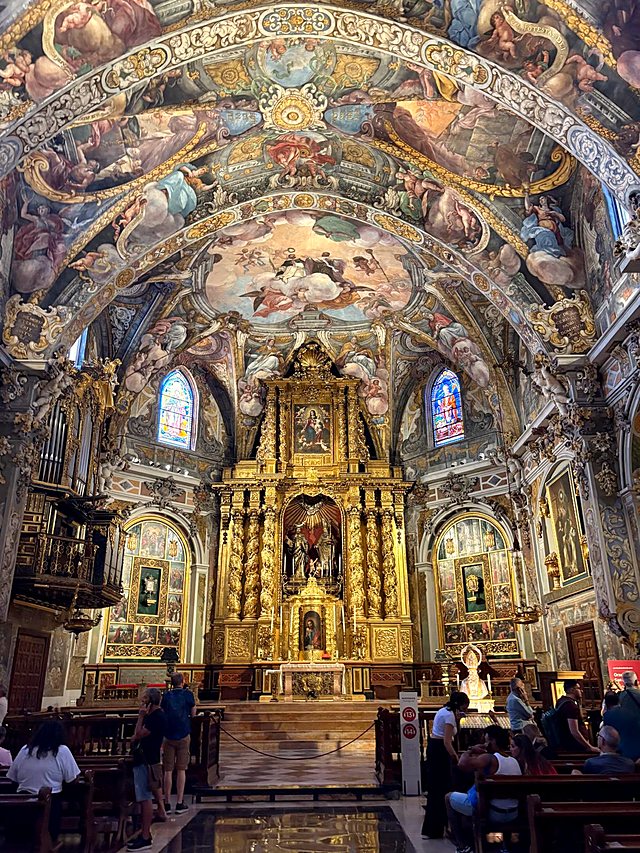 Inside San Nicolás church in Valencia: painted vaulted ceiling and a gilded altarpiece
